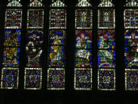 Stained glass windows depicting women in the cathedral