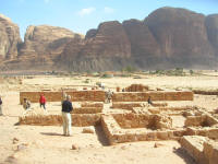 Nabatean temple with the town of Wadi Rum in the background