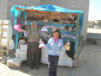 Doll seller in traditional Turkish pants