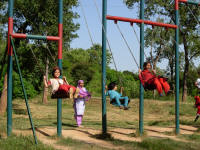 Children enjoying the swings