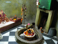 Lingam of Shiva with a cobra at the side