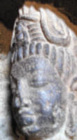 Cave 26 The smallest Buddha on the forehead of a sculptured face
