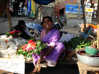 Flower seller. Theflowers are offered to the god.