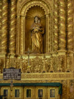 Our Lady of Hope with relics in glass fronted boxes beneath