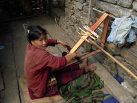 Woman weaving a strap