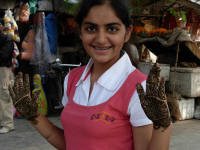 A happy youngwoman with henna decorations on her hands