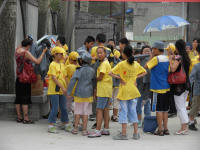 School Children about to visit the Long March Museum next to the hostel. They are busy dressing up.