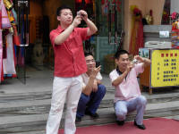His friends taking photos