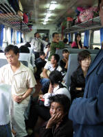 Crowded aisle. The guy in front is one of the tribal men