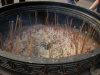Incense stick burning is a large pot