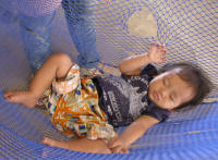 Baby asleep in his hammock