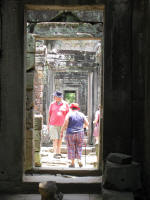 View through the corridors to a section with a collapsed roof.