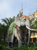 Rather large elephant outside a hotel - one of a pair
