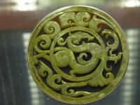 Jade ring with a dragon in the centre. Dragons derived from snake worship.