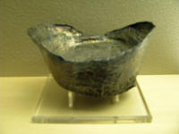Boat shaped silver coin. The shape is still used today to represent wealth.