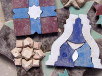 Mosaic pieces ready for placing. Bottom left, upside down.