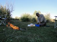 Washing up and keeping warm by the lake